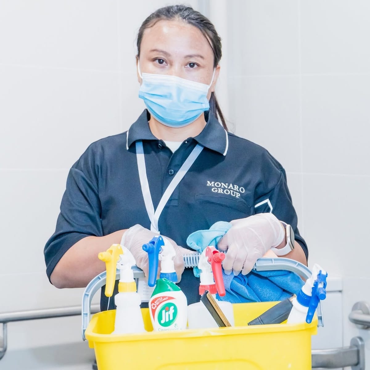 Monaro Group team member with a stocked cleaning trolley